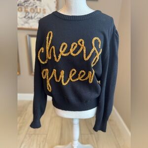 QUEEN OF SPARKLES Black Sweater with Cheers Gold Glitter Script